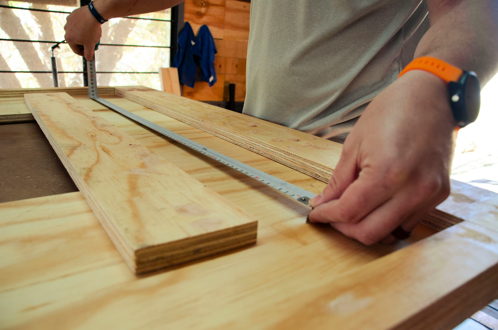 Carpenter measuring wood