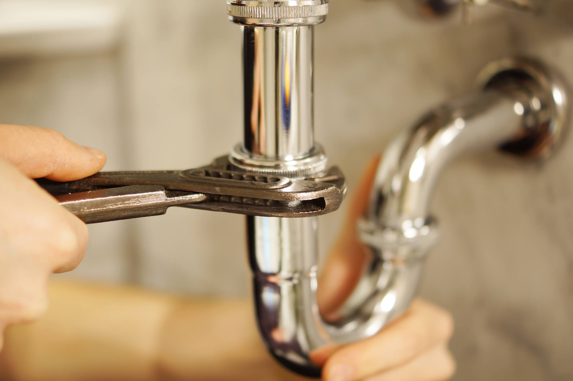 Plumber fixing a pipe